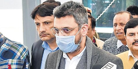 Sanjeev Chawla (C) was brought to New Delhi on Wednesday from the UK.