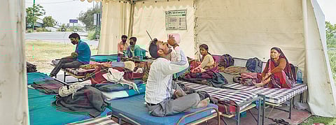 Migrant workers take refuge in a temporary Delhi Government-run shelter home | pti