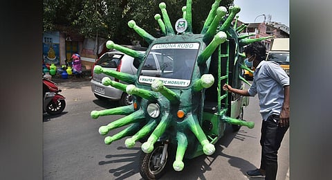 An auto shaped like coronavirus on its way to disinfect the Ka Ka Thope Braodway on Wednesday in Chennai. (Photo | P Jawahar, EPS)