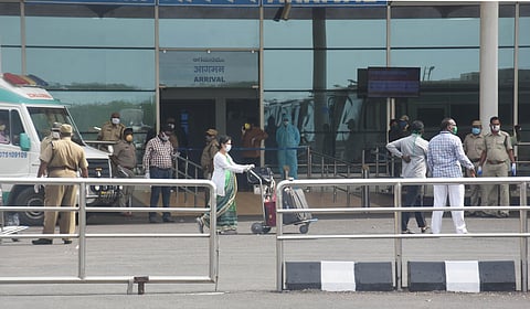 Passenger comes out of Vijayawada International Airport terminal who got down from flight came from London on Wednesday. (Photo | Prashant Madugala/EPS)