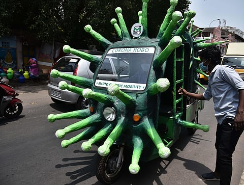 An auto decorated with the shape of Noval Vorona Virus on its way to disinfect the Ka Ka Thope Braodway on Wednesday in Chennai. (Photo | P Jawahar/EPS)