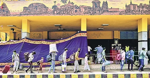 Migrant workers from Bihar on their way to Cantonment Railway Station to catch a train back home, in Bengaluru, on Wednesday | SHRIRAM BN