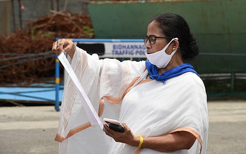 West Bengal Chief Minister Mamata Banerjee addresses media at NSCBI Airport ahead of Prime Minister Narendra Modi's arrival in Kolkata Friday May 22 2020. (Photo | PTI)