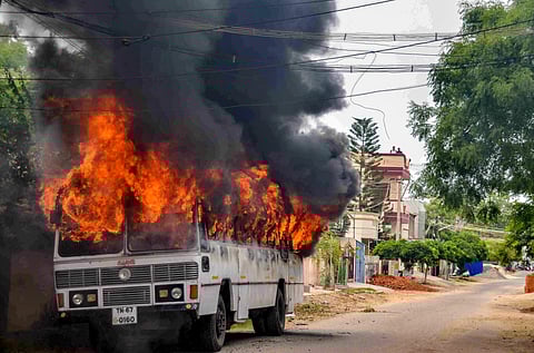 Smoke billows from a buring bus during protests demanding the closure of Vedanta's Sterlite Copper unit, in Thoothukudi. (Photo | PTI)