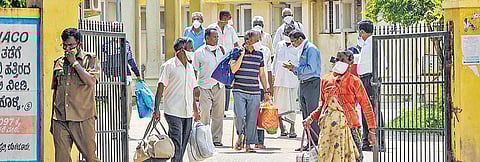 Patients who recovered from COVID-19 leave after being discharged from a hospital in Chikmagalur on Saturday | PTI