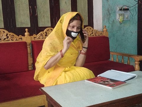 'Hello Bahan' admin Dr Madhu Upadhyay speaking to a woman on precautions to exercise in order to avoid contracting COVID-19 (Photo | EPS)