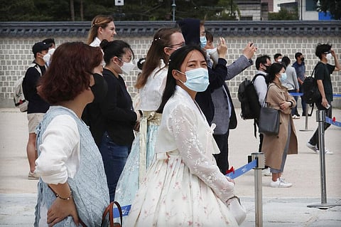 Visitors waring face masks in Seoul, South Korea. (Photo | AP)