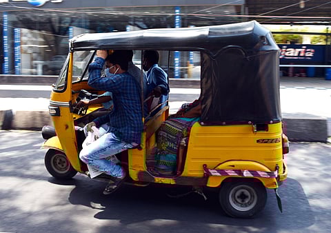 An auto carries more than two passengers at a time, in violation of the lockdown,  at Srinagar Colony in Hyderabad on Tuesday | S Senbagapandiyan