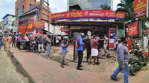 The government allowed liquor sales via BevQ, a mobile app, which will issue token and time slots to ensure there is no crowding outside the liquor shops. (Photo | B P Deepu, EPS)