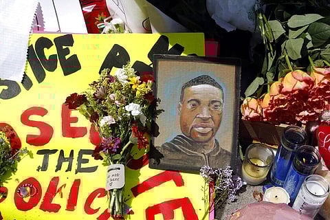 A chain portrait of George Floyd is part of the memorial for him, Wednesday, May 27, 2020, near the site of the arrest of Floyd who died in police custody Monday night in Minneapolis after video shared online by a bystander showed a white officer kneeling