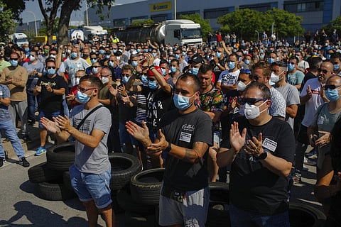 Nissan workers gather during a protest in Barcelona on Thursday. (Photo | AP)