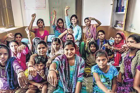 Monalisa Padhee (last row, third from left) with women at a programme at Barefoot College