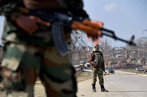 Soliders stand guard on the Srinagar-Jammu National Highway at Awantipora in Pulwama District. (File | PTI)