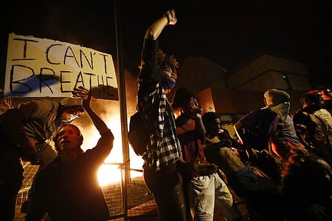 Potests over the death of George Floyd, a black man who died in police custody Monday, broke out in Minneapolis for a third straight night. (Photo | AP)