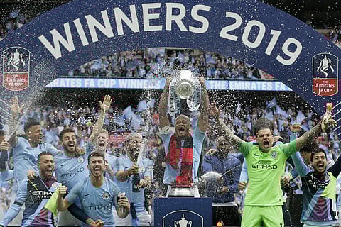 Manchester City players celebrate after winning the English FA Cup Final soccer match between Manchester City and Watford at Wembley stadium in London. (File Photo | AP)