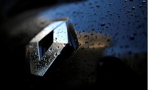 Raindrops cover the logo of French car manufacturer Renault. (File photo| Reuters)