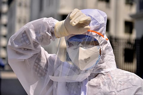 Health Workers engaged in a Covid-19 ward, standing outside Omandurara Medical College in Chennai. Express / DEBADATTA MALLICK.