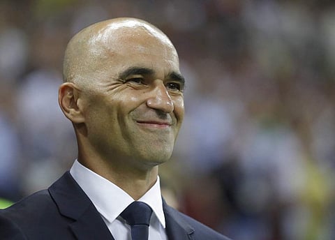Belgium coach Roberto Martinez smiles as he waits for the start of the quarterfinal match between Brazil and Belgium at the 2018 soccer World Cup in the Kazan Arena, in Kazan, Russia, Friday, July 6, 2018. | AP
