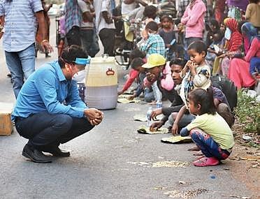 Dr Prasun Chatterjee of AIIMS interacting with a child in New Delhi  | express