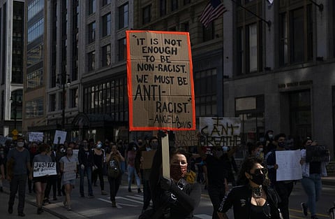 People march in Detroit during a rally calling for an end to police violence after the death of George Floyd, a handcuffed black man who died Memorial Day in the custody of the Minneapolis police, Friday May 29, 2020. (Photo | AP)
