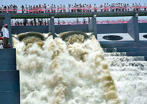 Water gushes out of the Makruk pump house at Kondapochamma Reservoir on Friday