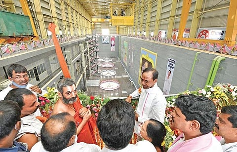 Chief Minister K Chandrasekhar Rao, along with Chinna Jeeyar Swamy, interacts with the officials while inspecting the Kondapochamma reservoir on Friday