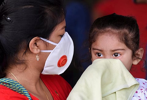 A woman passenger and her daughter on their arrival at the Jai Prakash Narayan International Airport from Delhi during ongoing COVID-19 lockdown in Patna Sunday May 31 2020. (Photo | PTI)