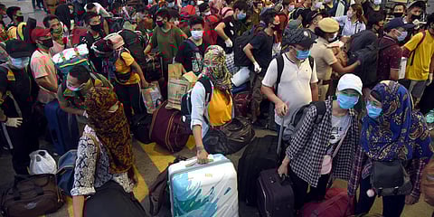 Migrants wait to board the special train to Manipur at Central railway station in Chennai. (Photo| Martin Louis, EPS)