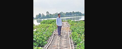 Shukur Ali stands one of the two bamboo bridges which he built in 2012 (Photo | Noor Muhammad)