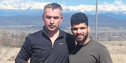 Judoka Jasleen Singh Saini (R) and Georgian coach Mamuka Kizilashvili