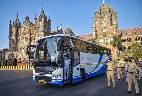 A group of migrants board a special bus to travel to their native place in Rajasthan during the ongoing COVID-19 lockdown in Mumbai Sunday May 3 2020. (Photo | PTI)
