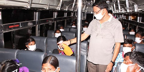 Migrant workers boarded the APSRTC bus at Pedakurapadu to reach their native places in Kurnool district. (File photo| EPS)