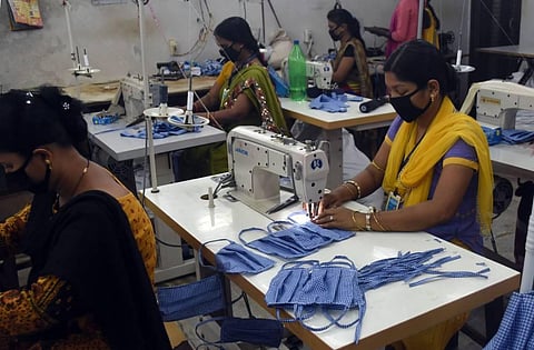 Women in Bhubaneswar sew face masks, the demand for which has multiplied in view of coronavirus pandemic. (Photo | Biswanath Swain, EPS)