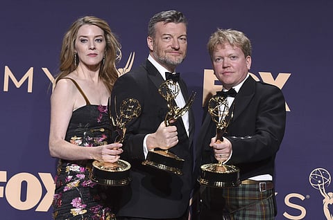 Annabel Jones, from left, Charlie Brooker and Russell McLean poses in the press room with the award for outstanding television movie for 'Black Mirror: Bandersnatch'