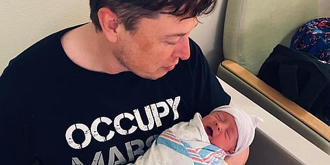 Tesla chief Elon Musk with his new born baby-named 'X AE A-12' (Photo| Twitter)