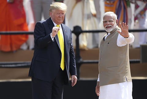 U.S. President Donald Trump and Indian Prime Minister Narendra Modi gesture towards the crowd during the 'Namaste Trump' event at Sardar Patel Stadium in Ahmedabad, India, Monday, Feb. 24, 2020. (File Photo | AP)