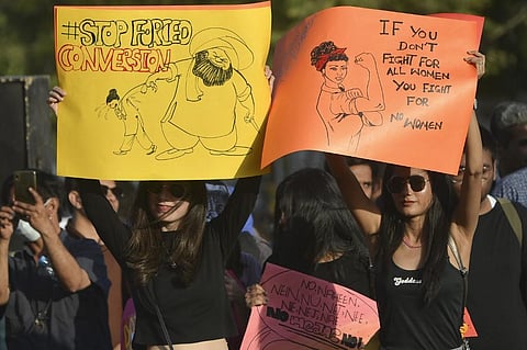 Activists of the Aurat (Woman) March hold placards during a rally to mark International Women's Day in Karachi. (Photo|AFP)