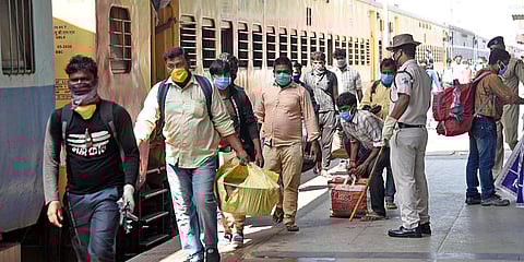 Migrants who were stranded in Bengaluru arrive at Danapur Railway Station via Special train, during the ongoing COVID-19 lockdown, in Patna. (Photo| ANI)