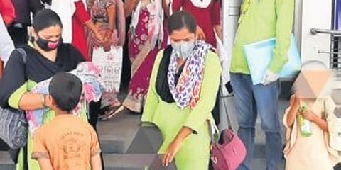 Childline officials taking custody of Sunil’s four children. (Photo | EPS)