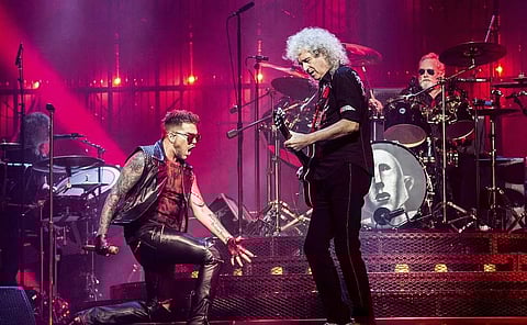 Adam Lambert (L) Brian May and Roger Taylor of Queen. | AP