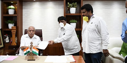 Karnataka Film Chamber of Commerce secretary NM Suresh with CM BS Yeddiyurappa