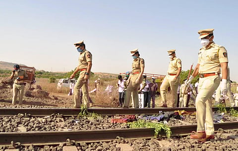 Police personnel inspect the spot after a goods train ran over a group of migrant workers while they were sleeping on the tracks, in Aurangabad. (Photo | PTI)