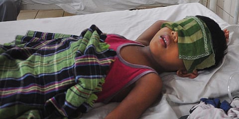 A boy's eyes were covered as a part of the gas leakage treatment to avoid any damage vision or reduce burning sensation at Rajendra Prasad ward in King George Hospital in Visakhapatnam. (Photo| G Satyanarayana, EPS)