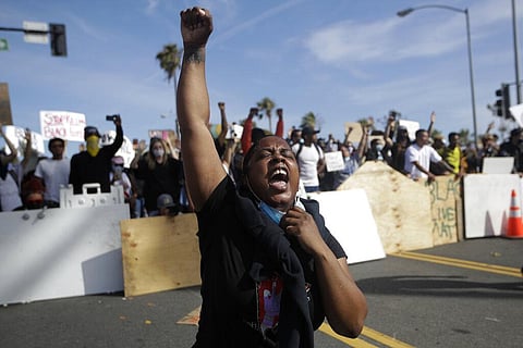 A protester yells Sunday, May 31, 2020, in Santa Monica, Calif. during unrest and protests over the death of George Floyd, a black man who was in police custody in Minneapolis. (Photo | AP)