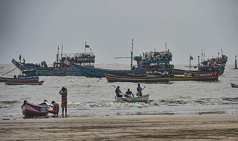 Fishing boats seen anchored at a shore following a warning by Indian Meteorological Department IMD for fishermen not to enter the Arabian Sea for the next two days as a precaution against cyclone 'Nisarga' at Uttan beach in Thane on Monday. (Photo | PTI)