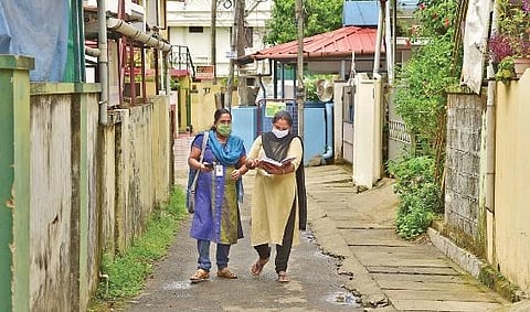 Sreeja Raju (left) and Shyni Martin, two Accredited Social Health Activists, during their daily activities in the Palarivattom division. Ever since the Covid-19 outbreak, these health workers have been working tirelessly to provide every assistance to fam