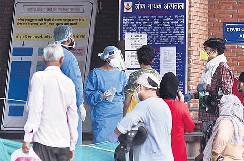 Medical workers interact with visitors outside the Covid-19 ward at LNJP. (Photo | Parveen Negi, EPS)