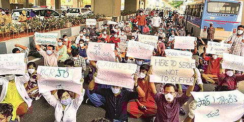 The doctors blocked the road outside Gandhi Hospital in Hyderabad, the city’s primary COVID-19 facility. (Photo | PTI)
