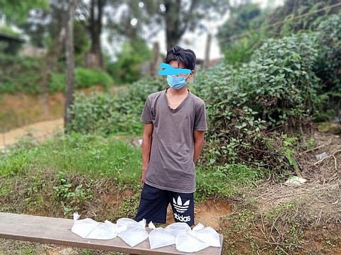 One of the returnees with the liquour in pouches (Photo | EPS)