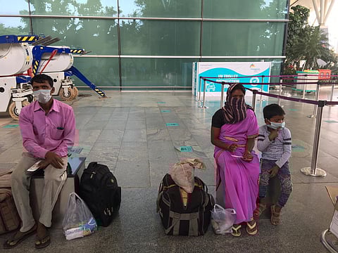Migrant workers from Tamil Nadu heading to Chhatisgarh waiting for their flight at Kempegowda International Airport in Bengaluru. (Photo | Express)